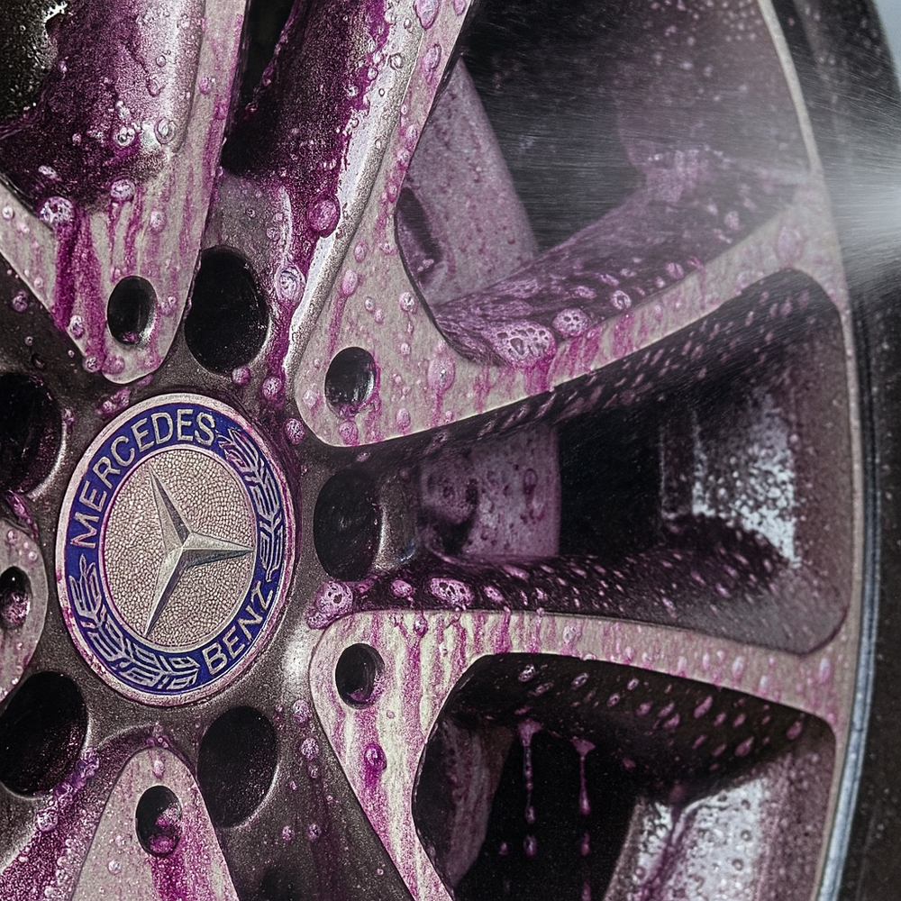 Ultra Wheel Cleaner in use on a wheel with a purple reaction indicator