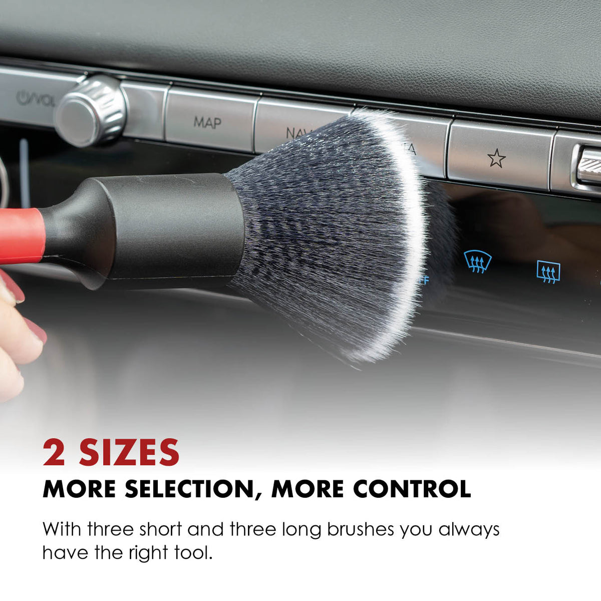 Soft detailing brush cleaning the controls in a car interior